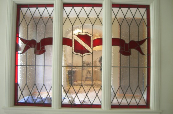Crest with Red Ribbon Stained and Leaded Glass James Thomas Stained and Leaded Glass