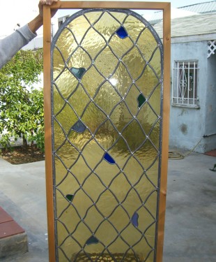wavy diamond staind glass window with arched top