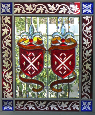 red and blue crest beveled stained glass window