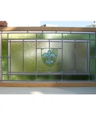 stained glass window with pale green crest