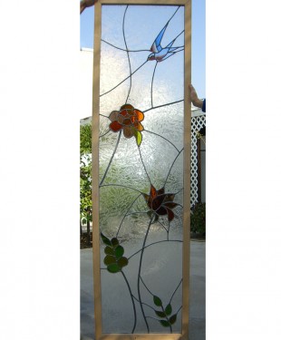 stained glass window with flowers and bird