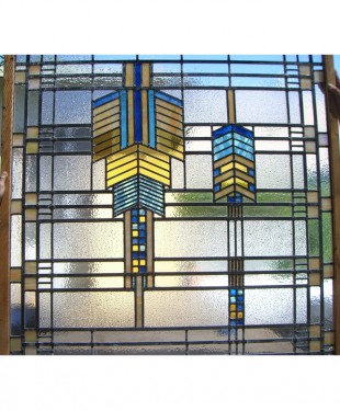 art deco window with indian breast plate design